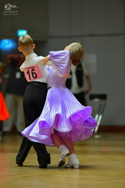 Dancesport competitor #16: Male dancer: white long-sleeved shirt and black trousers