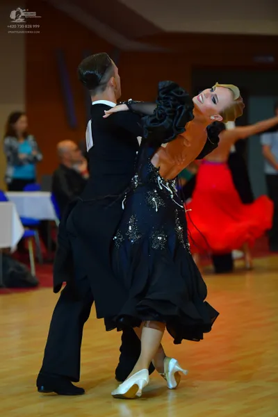 Dancesport competitor: Male dancer: black suit and black trousers