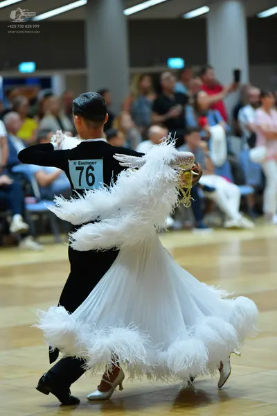 Dancesport competitor #76: Male dancer: black long-sleeved shirt and black trousers with black dance shoes