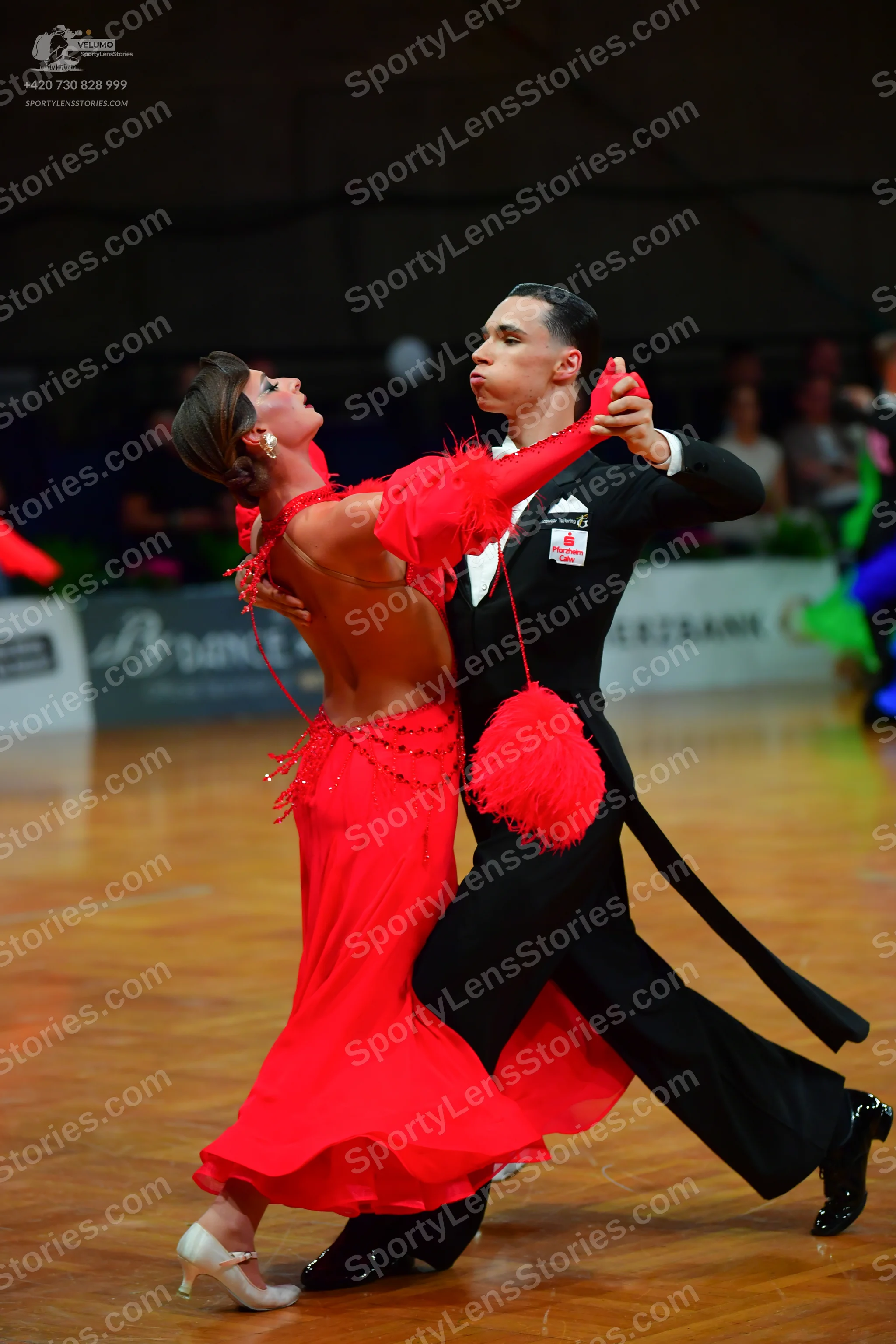 Dancesport competitor: Male:** Black tailsuit with sequin lapels