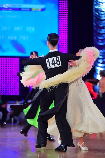 Dancesport competitor #148: Male dancer: black suit, white shirt, black bow tie, and black trousers